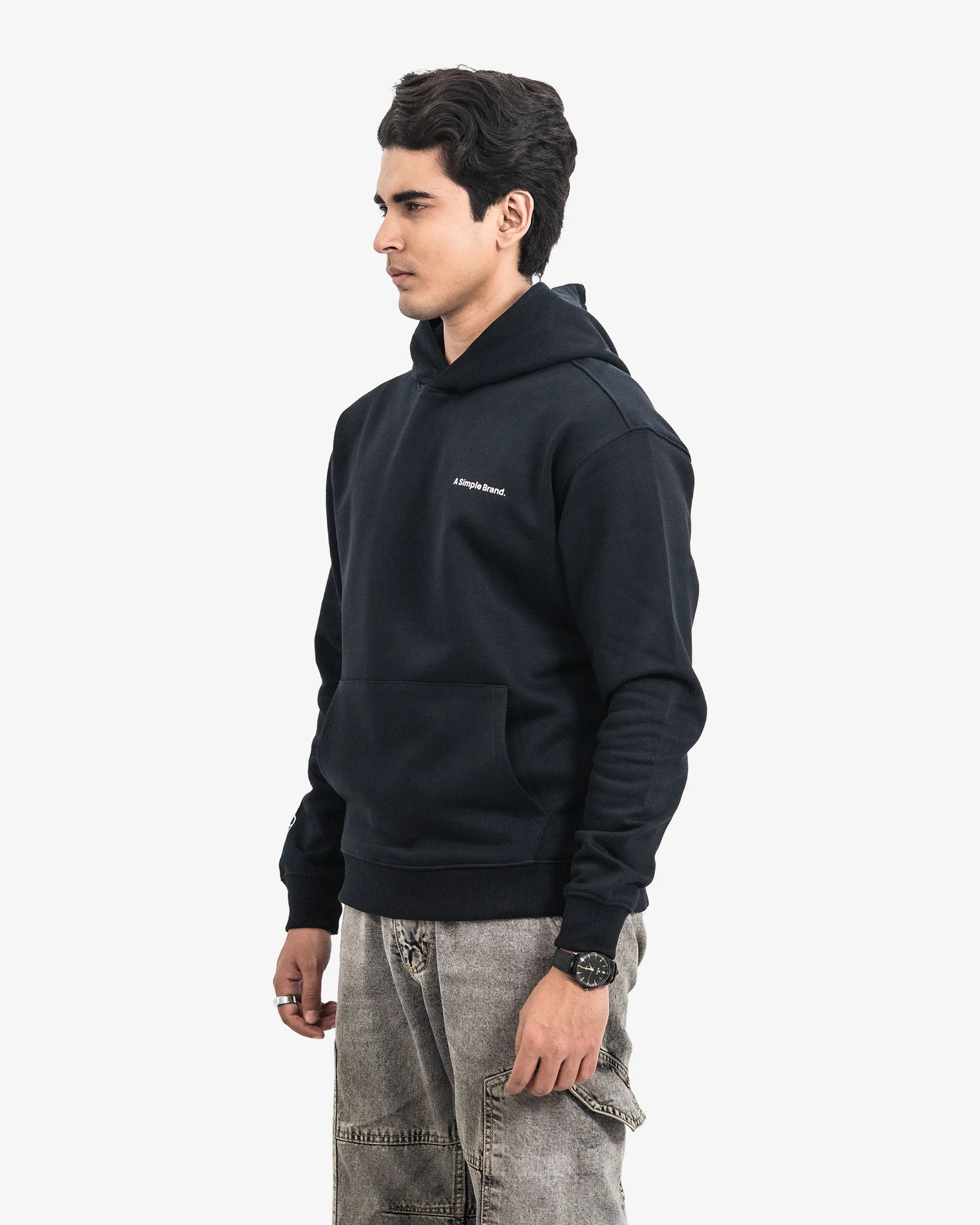 Man wearing a black hoodie  on a white background