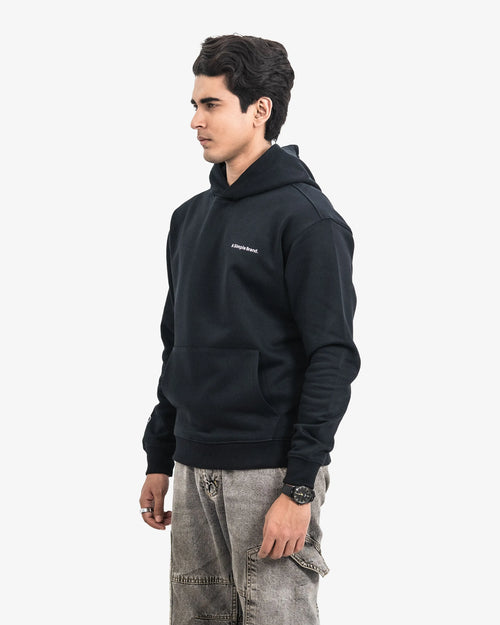 Man wearing a black hoodie  on a white background