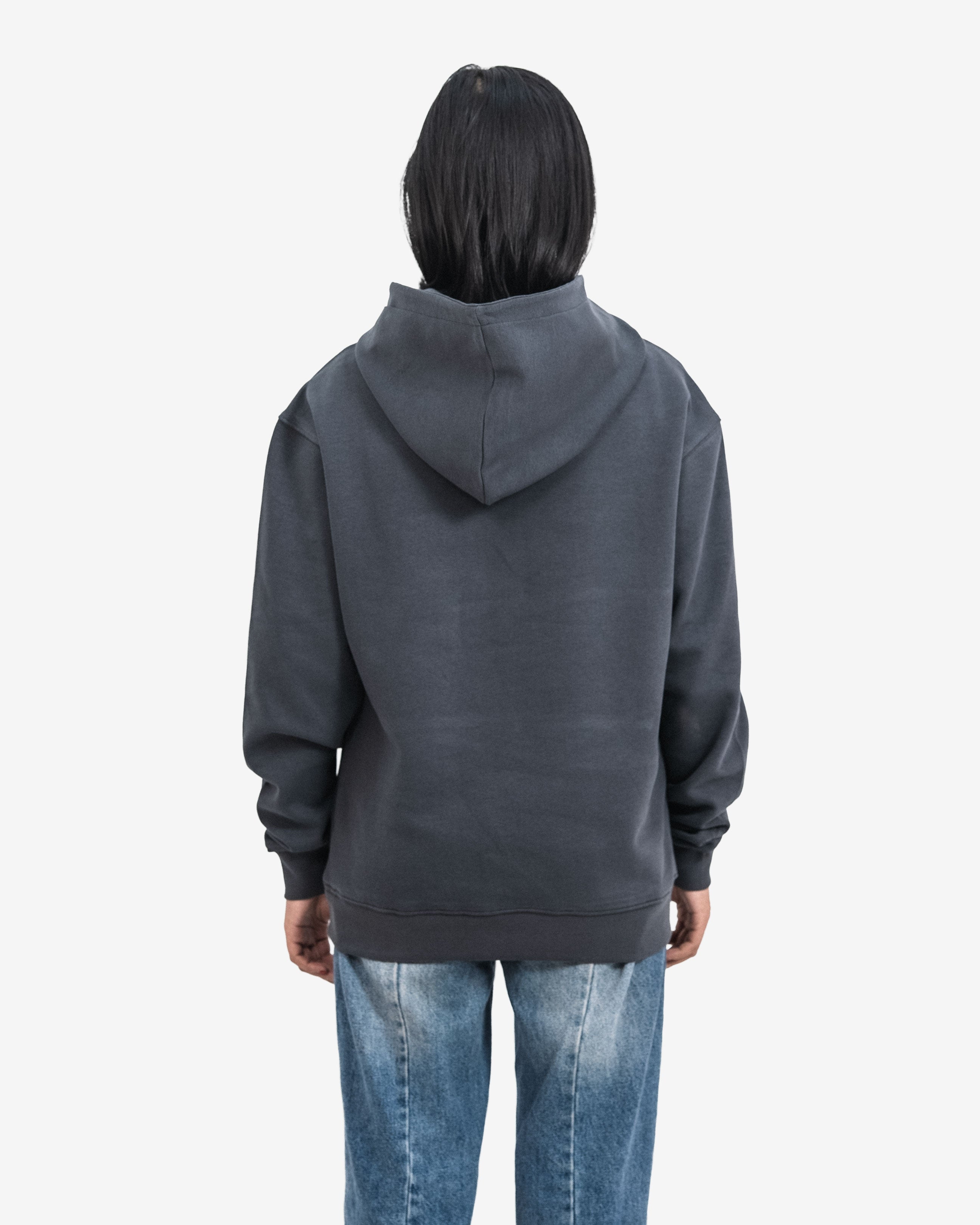 Person wearing a dark gray hoodie.