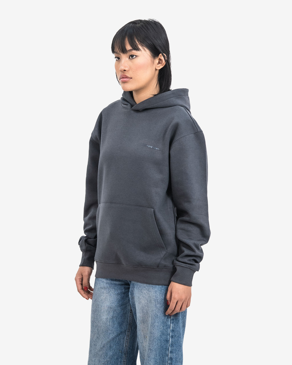 Person wearing a dark gray hoodie.