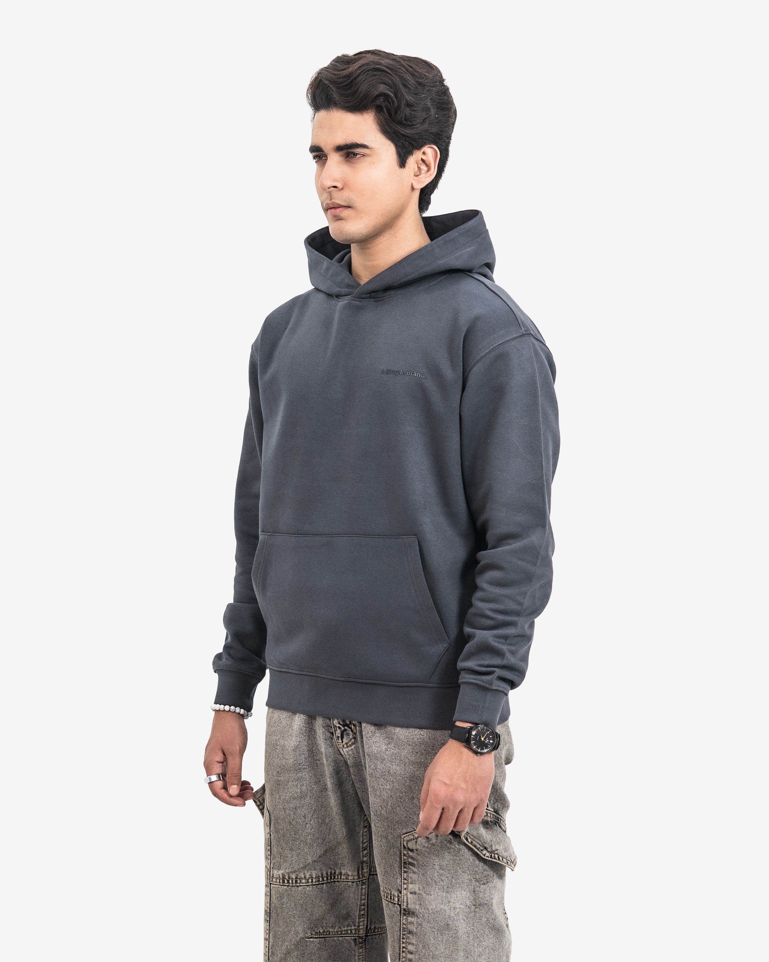 Man wearing a dark gray hoodie on a white background