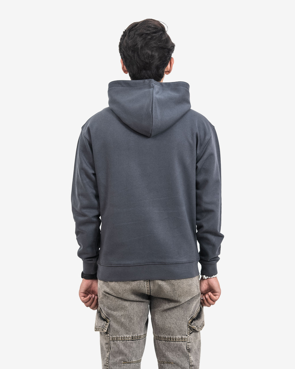 Person wearing a dark gray hoodie from behind on a white background